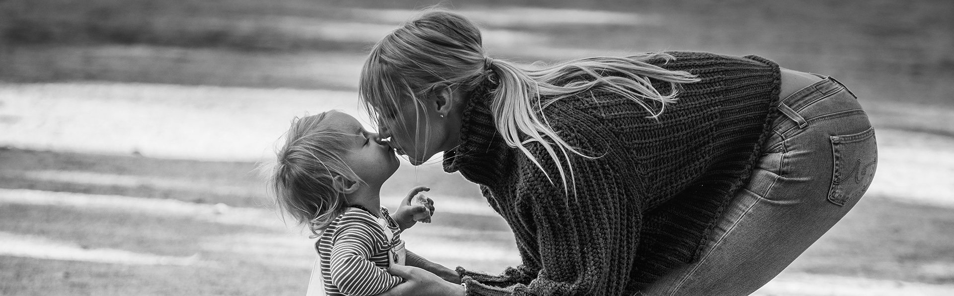 Mother and Daughter kisses black and white