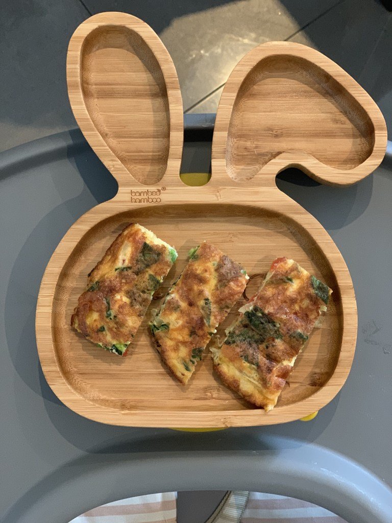 Vegetable Frittata in a wooden rabbit plate for babies